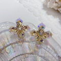 Shangjie oem aretes al por mayor de la moda bling aretes de encanto púrpura aretes de cristal amarillo pendientes de flores